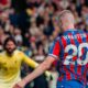 Adam Wharton shoots at Alisson Becker